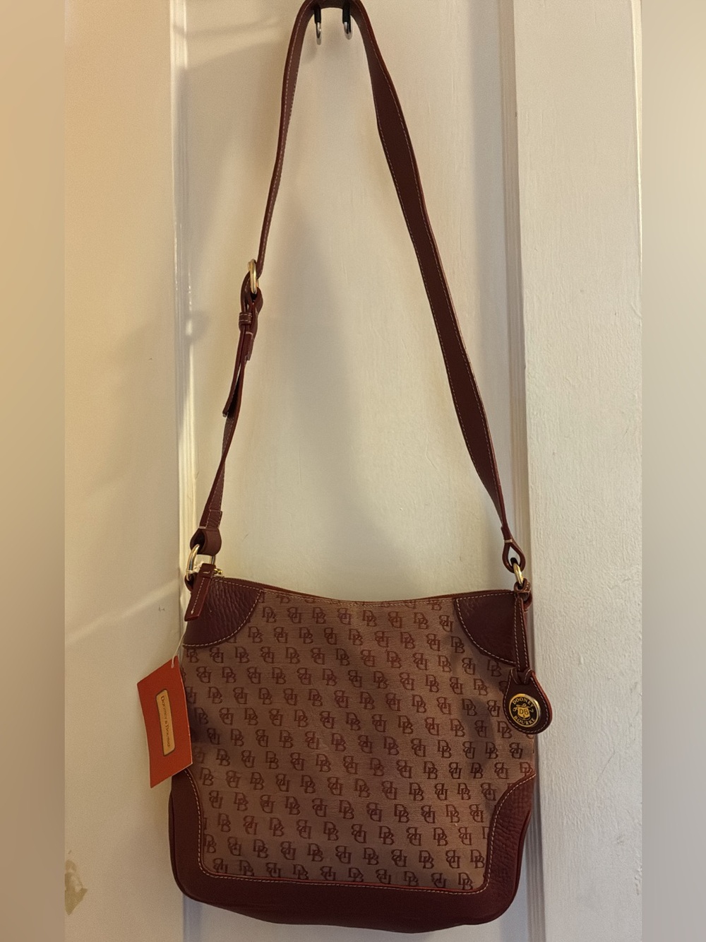 Dooney & Bourke Burgundy signature monogram canvas hobo bag